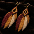 Feather earrings with beaded diamond